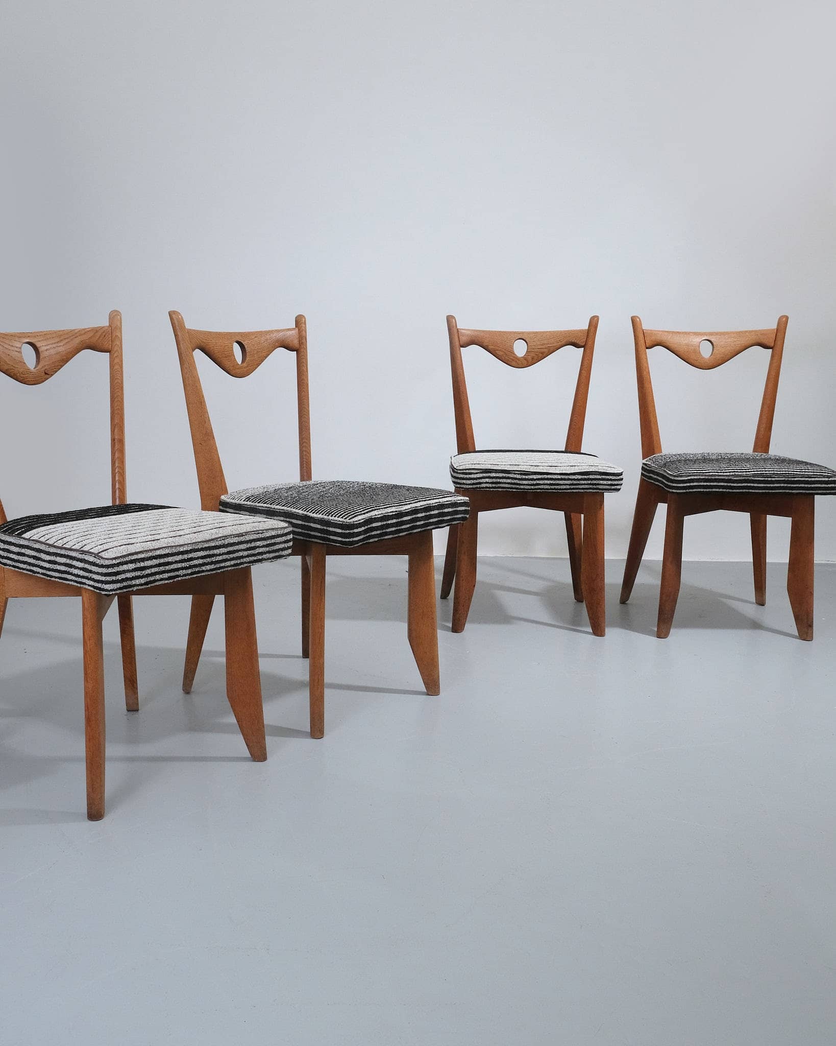 Set of Four Dining Chairs With Circular Cut-out Detail