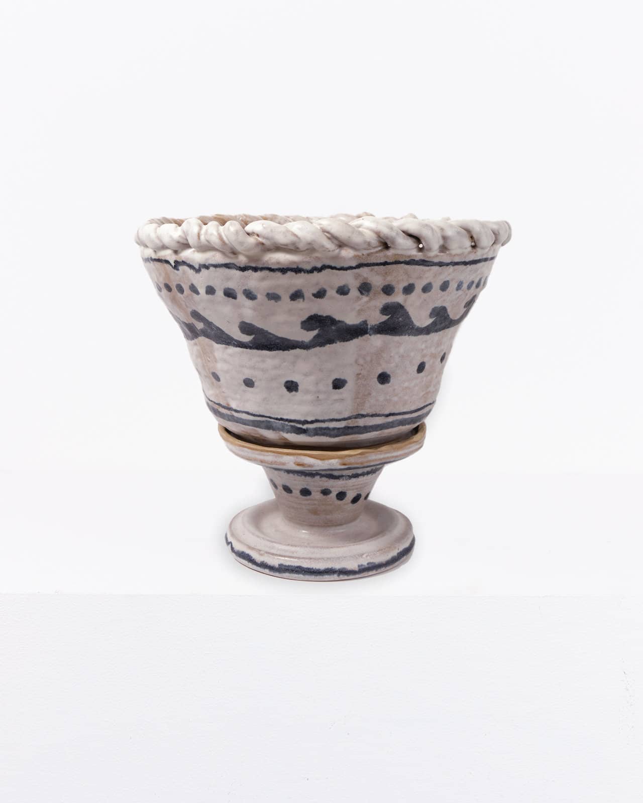 Black and white plaited pot with stand