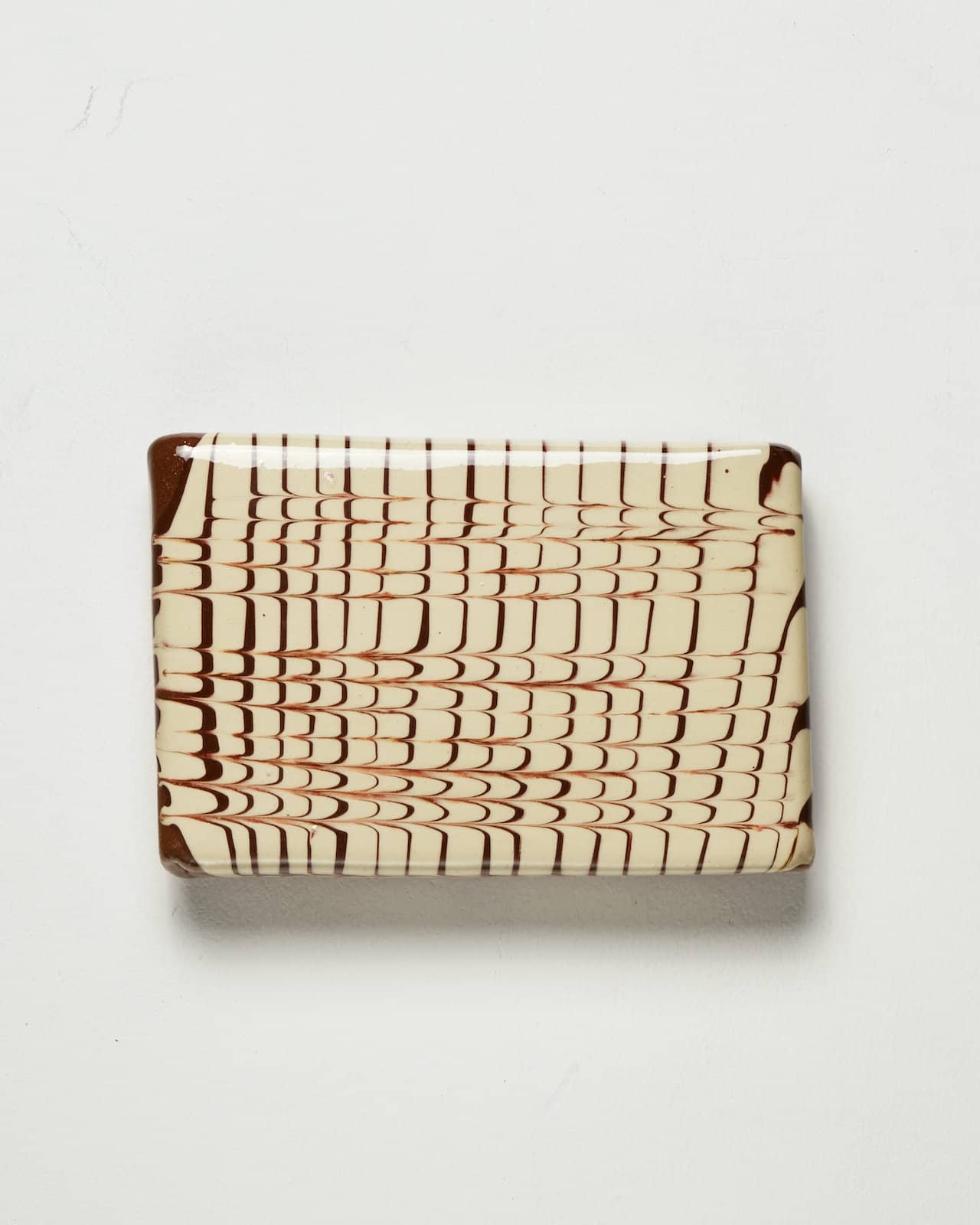 Slip pillow feathering cream slip on terracotta