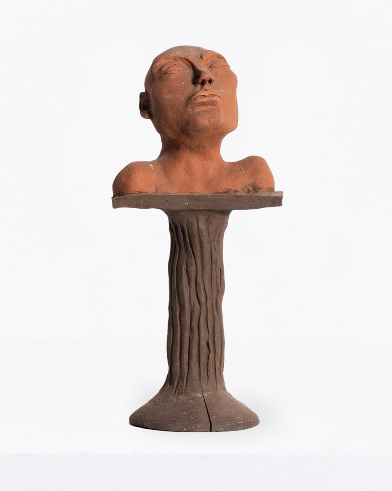 Small Male Head on Pedestal