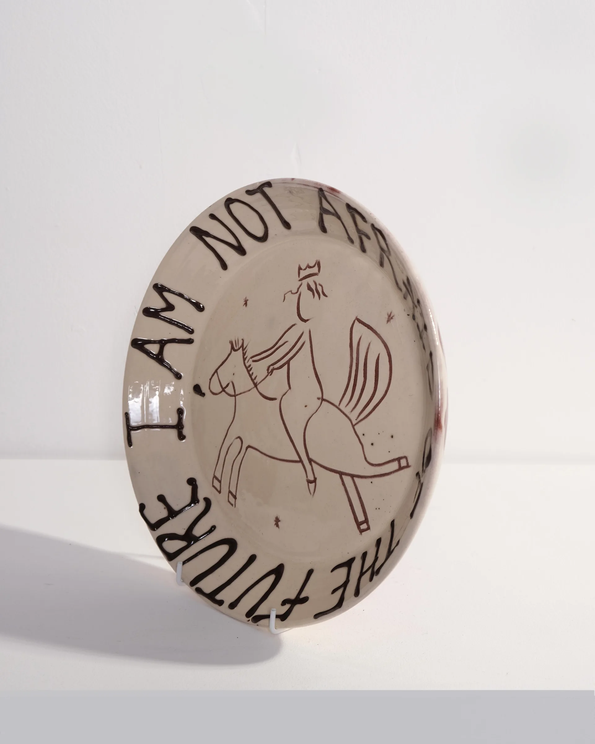 Large Plate with 'I am not afraid of the future' and Person Riding Horse Design