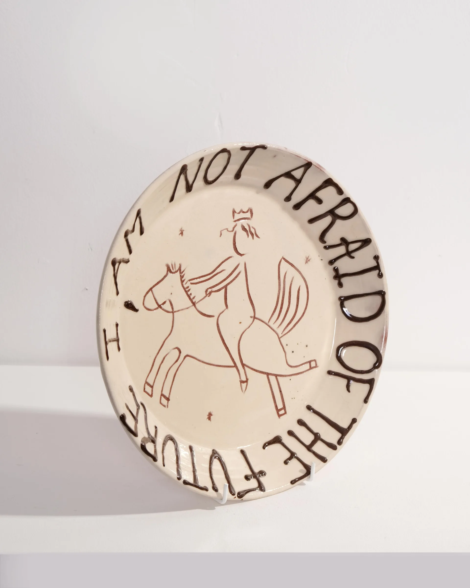Large Plate with 'I am not afraid of the future' and Person Riding Horse Design