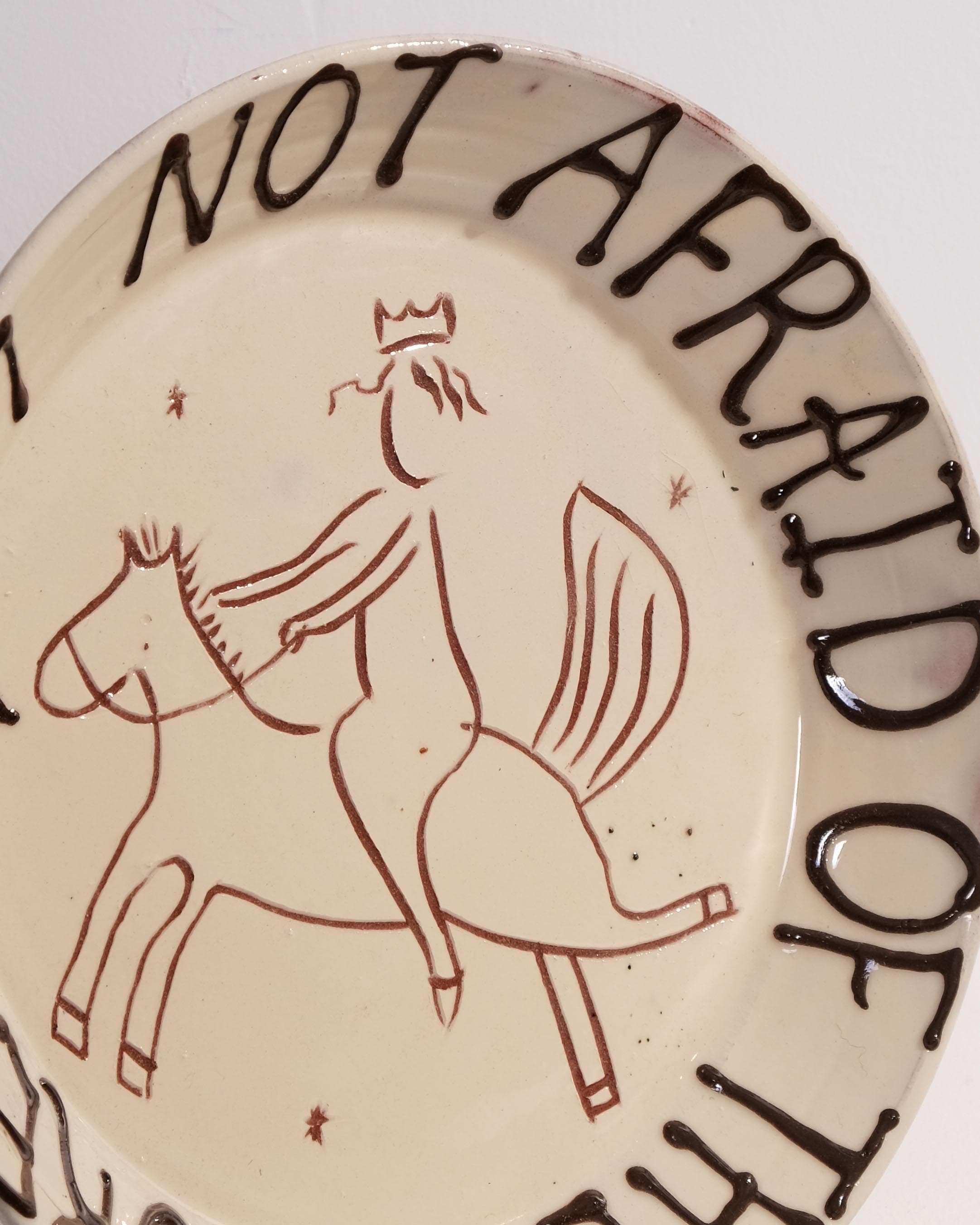 Large Plate with 'I am not afraid of the future' and Person Riding Horse Design